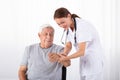 Doctor Examining Male Patient`s Pulse Royalty Free Stock Photo