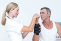 Doctor examining a man wrist Royalty Free Stock Photo