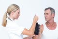 Doctor examining a man wrist Royalty Free Stock Photo