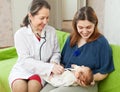 Doctor examining newborn baby with phonendoscope Royalty Free Stock Photo