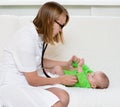 Doctor examining newborn baby with stethoscope Royalty Free Stock Photo