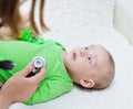 Doctor examining newborn baby with stethoscope Royalty Free Stock Photo
