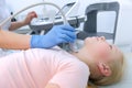 Doctor examining patient child girl thyroid gland using ultrasound scanner. Royalty Free Stock Photo