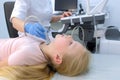 Doctor examining child girl thyroid gland using ultrasound scanner, closeup. Royalty Free Stock Photo