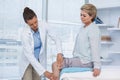 Doctor examining patient knee Royalty Free Stock Photo