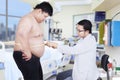 Doctor examining a patient obesity 1 Royalty Free Stock Photo