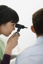 Doctor Examining Patient's Ear Royalty Free Stock Photo