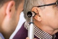 Doctor Examining Patient's Ear