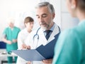 Doctor examining a patient`s medical records Royalty Free Stock Photo