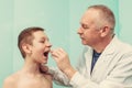 Doctor examining patient s mouth