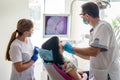 Doctor examining patient`s teeth with intraoral camera. Royalty Free Stock Photo