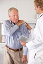 Doctor Examining Patient With Shoulder Pain
