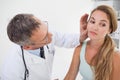 Doctor examining patients face Royalty Free Stock Photo