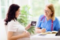 Doctor examining pregnant woman. Pregnancy check Royalty Free Stock Photo