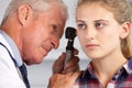 Doctor Examining Teenage Girl's Ears Royalty Free Stock Photo