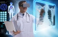 The doctor examining x-ray images using virtual reality glasses Royalty Free Stock Photo