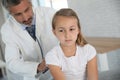 Doctor examining young girl in hospital office Royalty Free Stock Photo