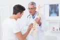 Doctor explaining anatomical spine to his patient Royalty Free Stock Photo