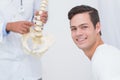 Doctor explaining anatomical spine to his patient Royalty Free Stock Photo