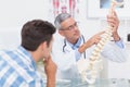 Doctor explaining anatomical spine to his patient Royalty Free Stock Photo