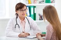 Doctor explaining diagnosis to her female patient Royalty Free Stock Photo