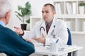 Doctor explaining diagnosis to his patient Royalty Free Stock Photo