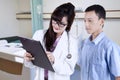 Doctor explaining examination report to her patient Royalty Free Stock Photo