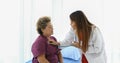 Doctor explaining medication to old woman patient at Hospitals Royalty Free Stock Photo