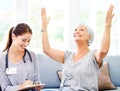 Your test came back negative. A doctor explaining positive test results to an overjoyed senior patient.