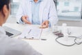 Doctor explaining prescription to male patient, healthcare concept Royalty Free Stock Photo