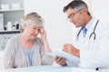 Doctor explaining prescription to senior patient Royalty Free Stock Photo