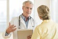 Doctor Explaining Report To Patient In Hospital Royalty Free Stock Photo