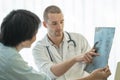 Doctor explaining result of radiography test to patient Royalty Free Stock Photo