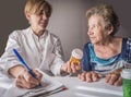 Doctor explains to elderly daily dose of medication Royalty Free Stock Photo