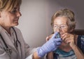 Doctor explains to old woman how ventimask inhalation training works Royalty Free Stock Photo