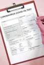 Doctor filling medical form for coronavirus test