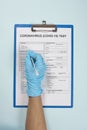 Doctor filling medical form for coronavirus test