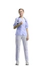 The doctor, in full height, on a white background, shows a thumbs up Royalty Free Stock Photo