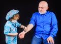 Doctor game. Family playing in doctor and patient. Child boy playing with grandfather. Kid in medical mask with stethoscope. Royalty Free Stock Photo