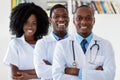 Doctor and general practitioner and nurse as african american medical team Royalty Free Stock Photo