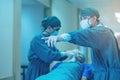 Doctor Getting their patient ready for the next procedure In the corridor, a medical team is pushing an emergency stretcher bed Royalty Free Stock Photo