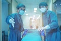 Doctor Getting their patient ready for the next procedure In the corridor, a medical team is pushing an emergency stretcher bed Royalty Free Stock Photo