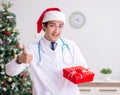 Doctor with gift box in the hospital Royalty Free Stock Photo