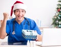 Doctor with gift box in the hospital Royalty Free Stock Photo