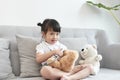 A doctor girl playing and cure bear at the pediatric Royalty Free Stock Photo