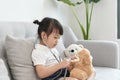 A doctor girl playing and cure bear at the pediatric Royalty Free Stock Photo