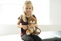 A doctor girl playing and cure bear at the pediatric