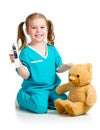 Doctor girl playing and measuring temperature toy