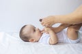 A doctor gives newborn baby rotavirus vaccine. Child immunization with little drop in clinic.Baby boy gets medicine from a little