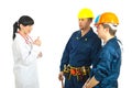 Doctor giving advices to workers men Royalty Free Stock Photo